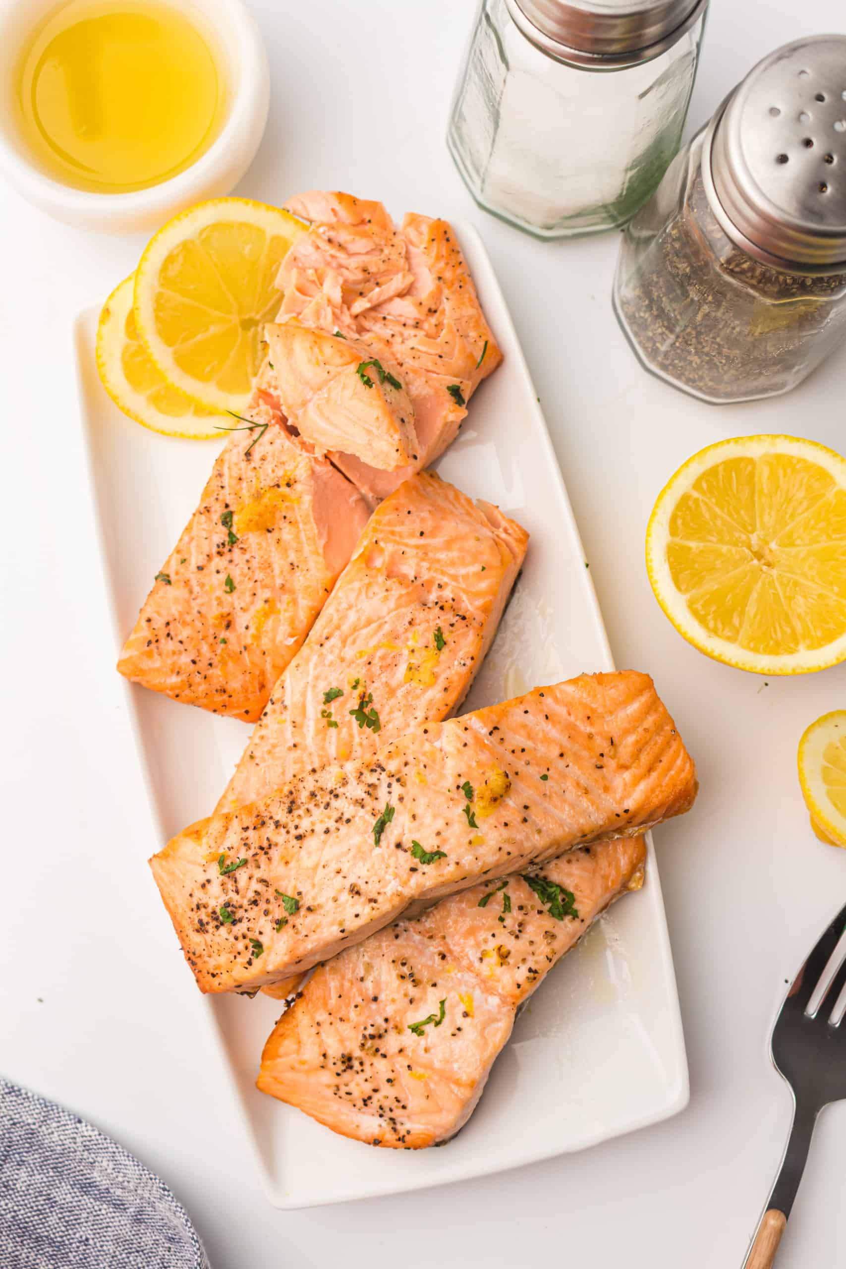 Overhead view of flaky salmon fillets cooked in the air fryer.