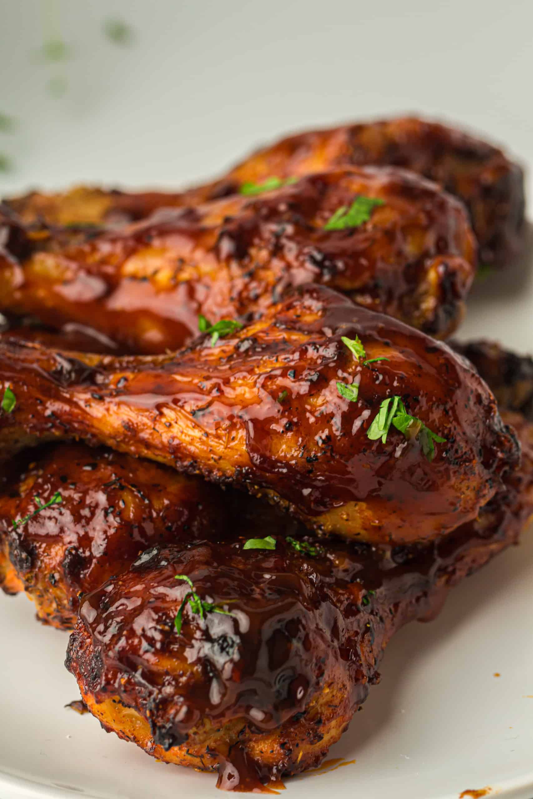Cloesup of air fryer BBQ drumsticks.