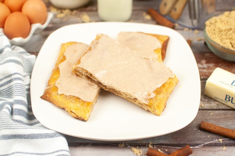 Cinnamon pop tart on white plate.