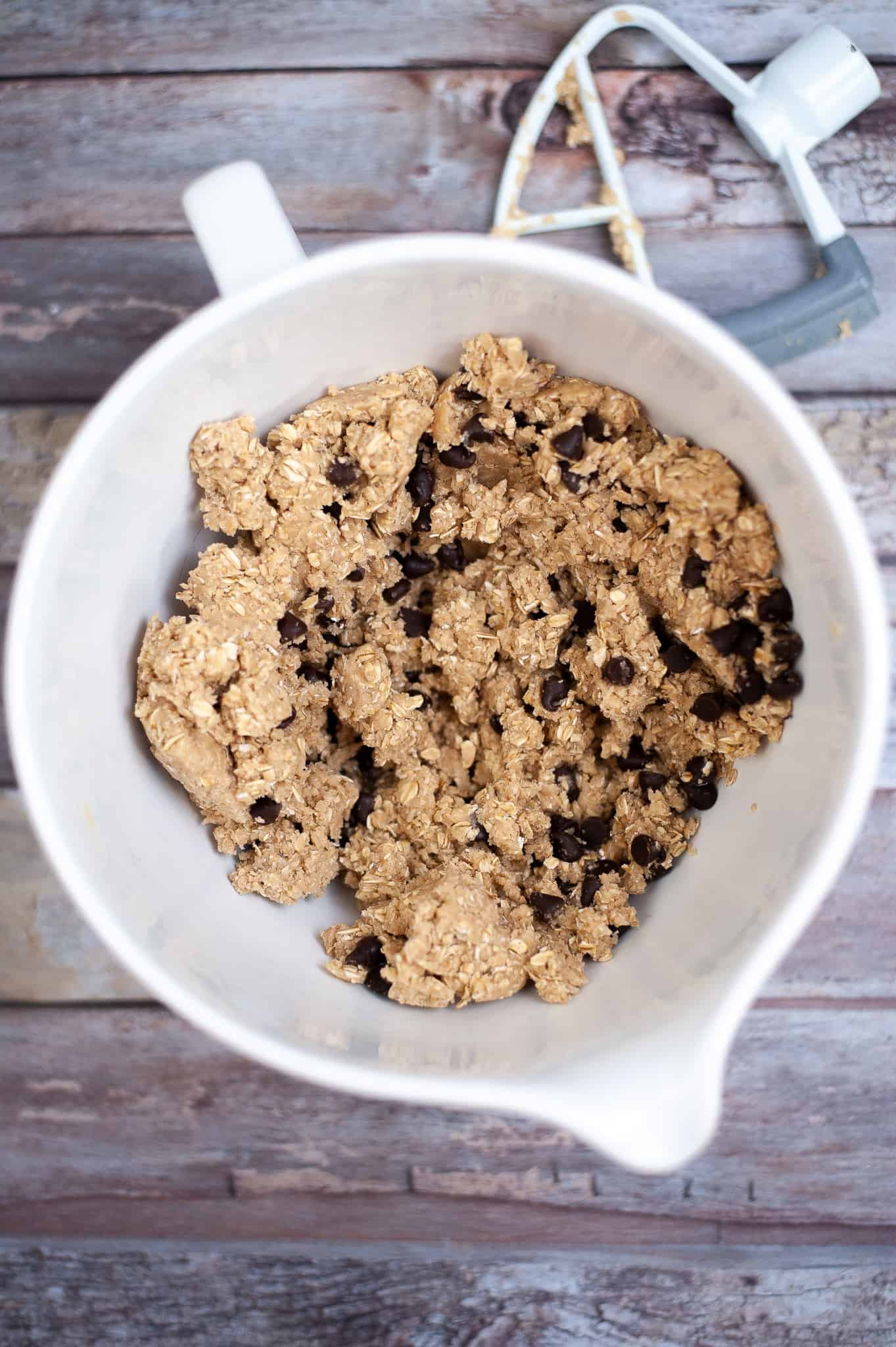 Overhead view of oatmeal chocolate chip cookie dough in a bowl.