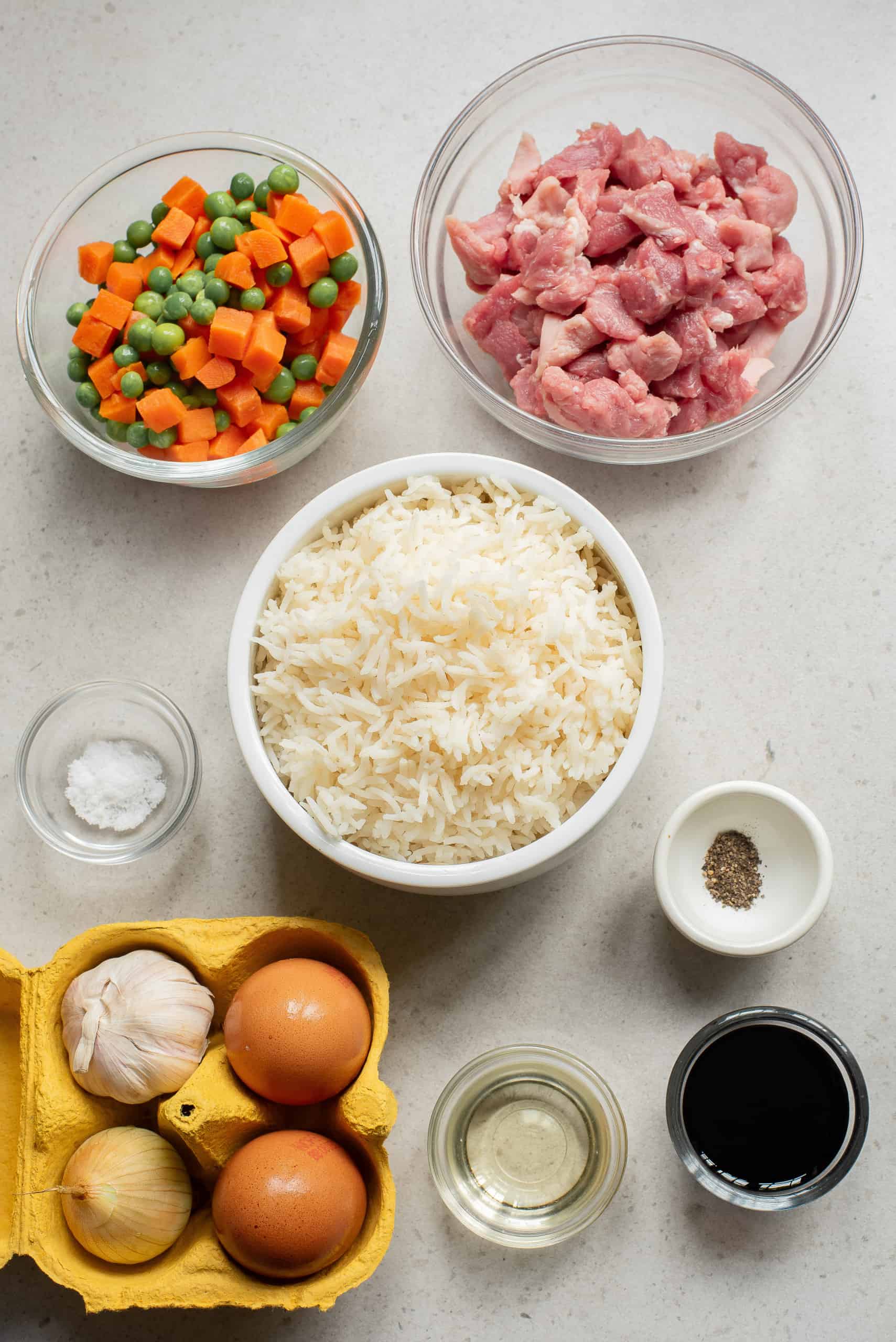 Overhead view of pork fried rice ingredients.