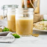 Headon view of Rotisserie Chicken Stock in Mason jars.