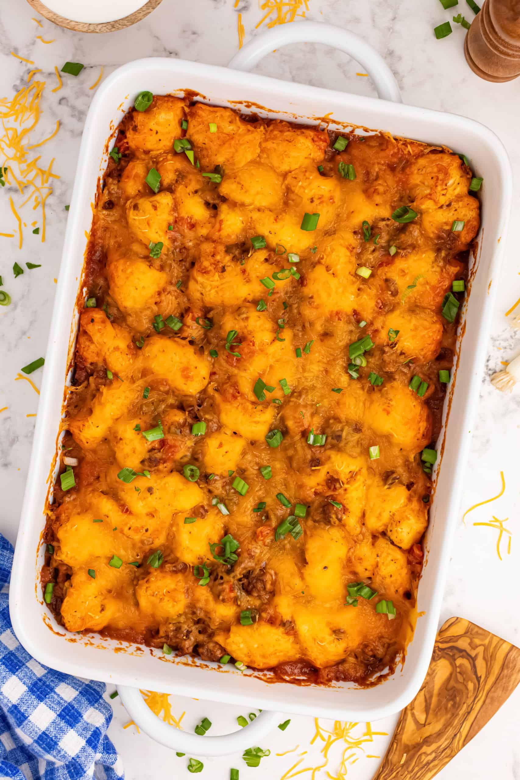 Overhead view of cooked Taco Bake with ground beef in a casserole dish.