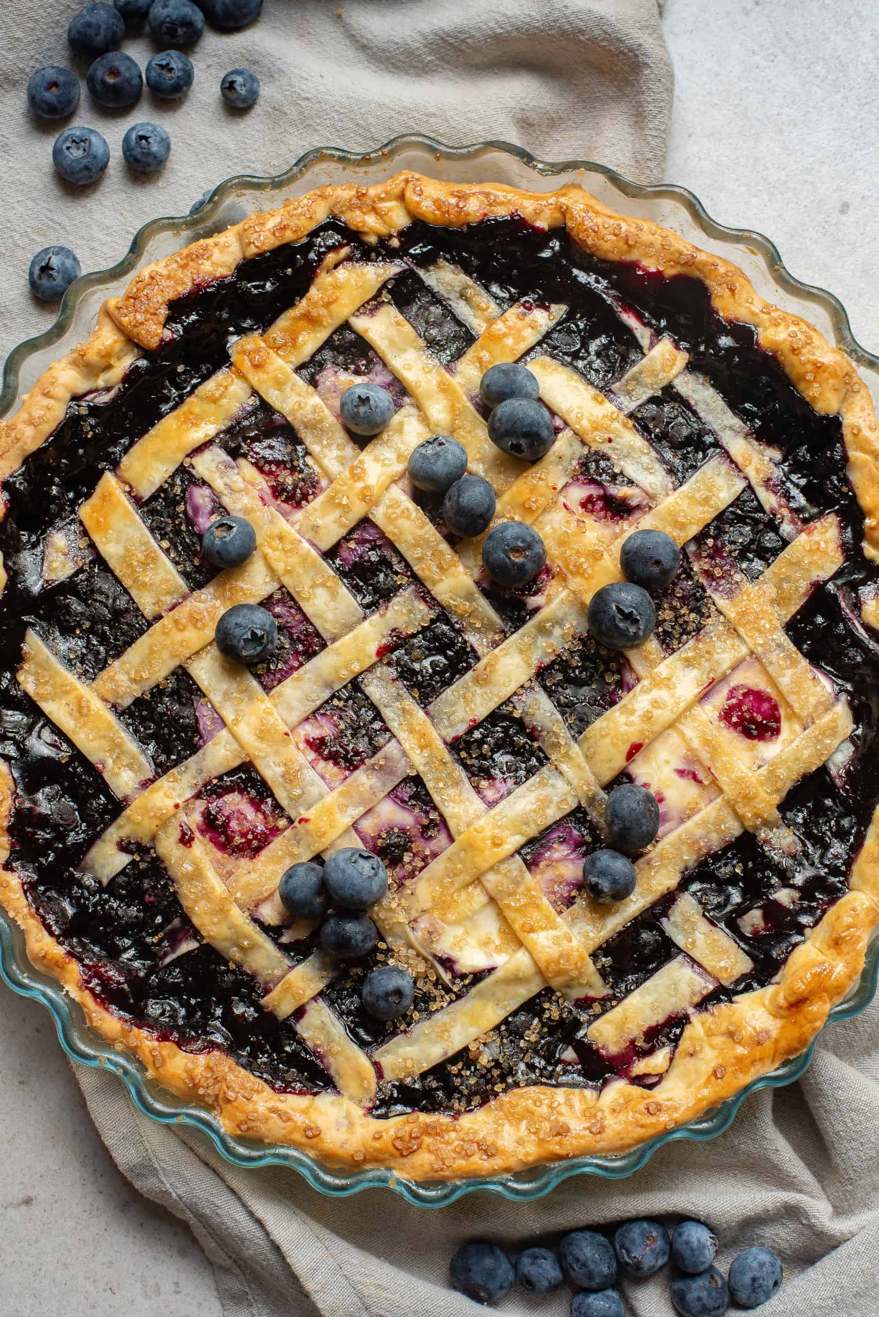 Overhead view if baked blueberry pie with cream cheese.