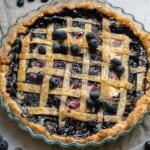 Overhead view of blueberry cream cheese pie with lattice top.