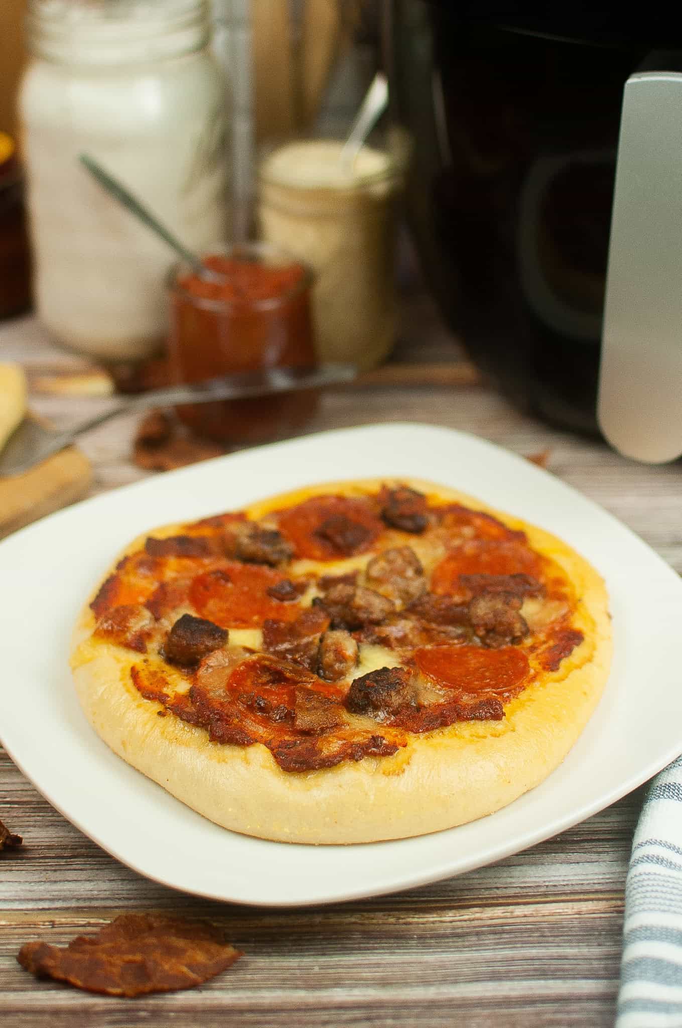 Meat Lover's Pizza in front of the air fryer.