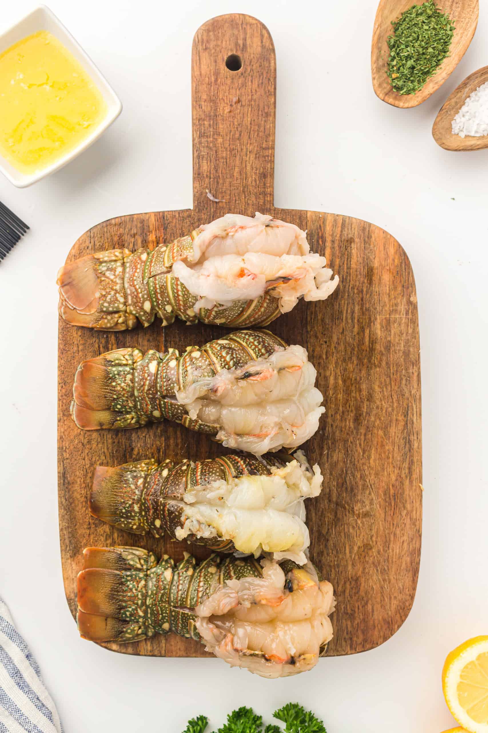 Overhead view of butterflied lobster tails.