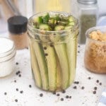 Homemade dill pickle spears in a jar.