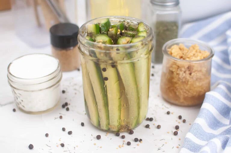 Homemade dill pickle spears in a jar.