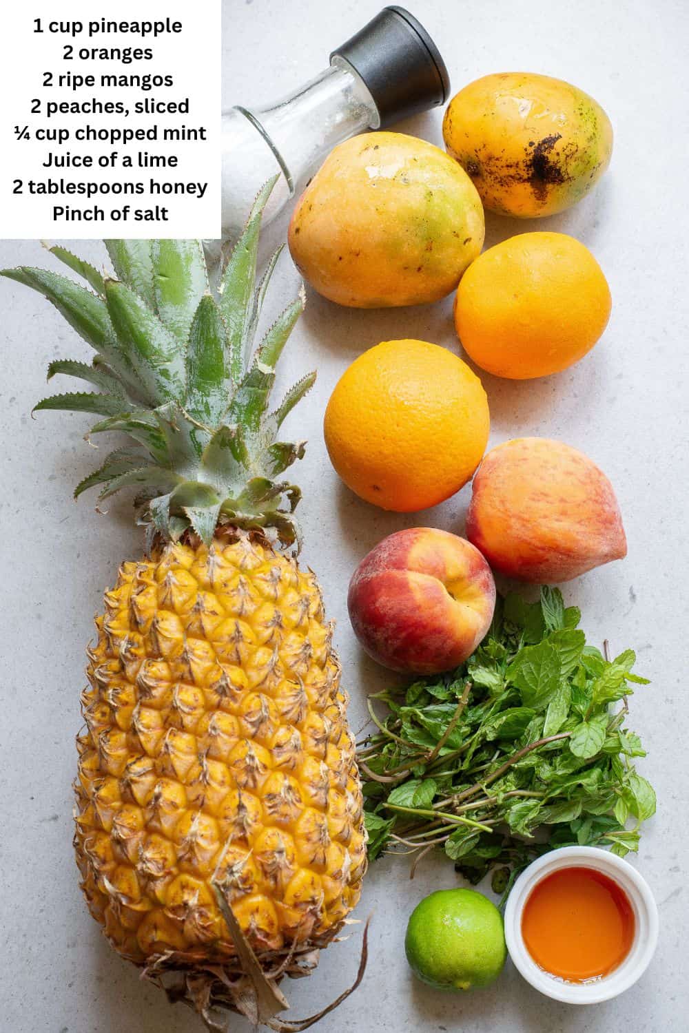 Overhead view of ingredients for summer fruit salad.