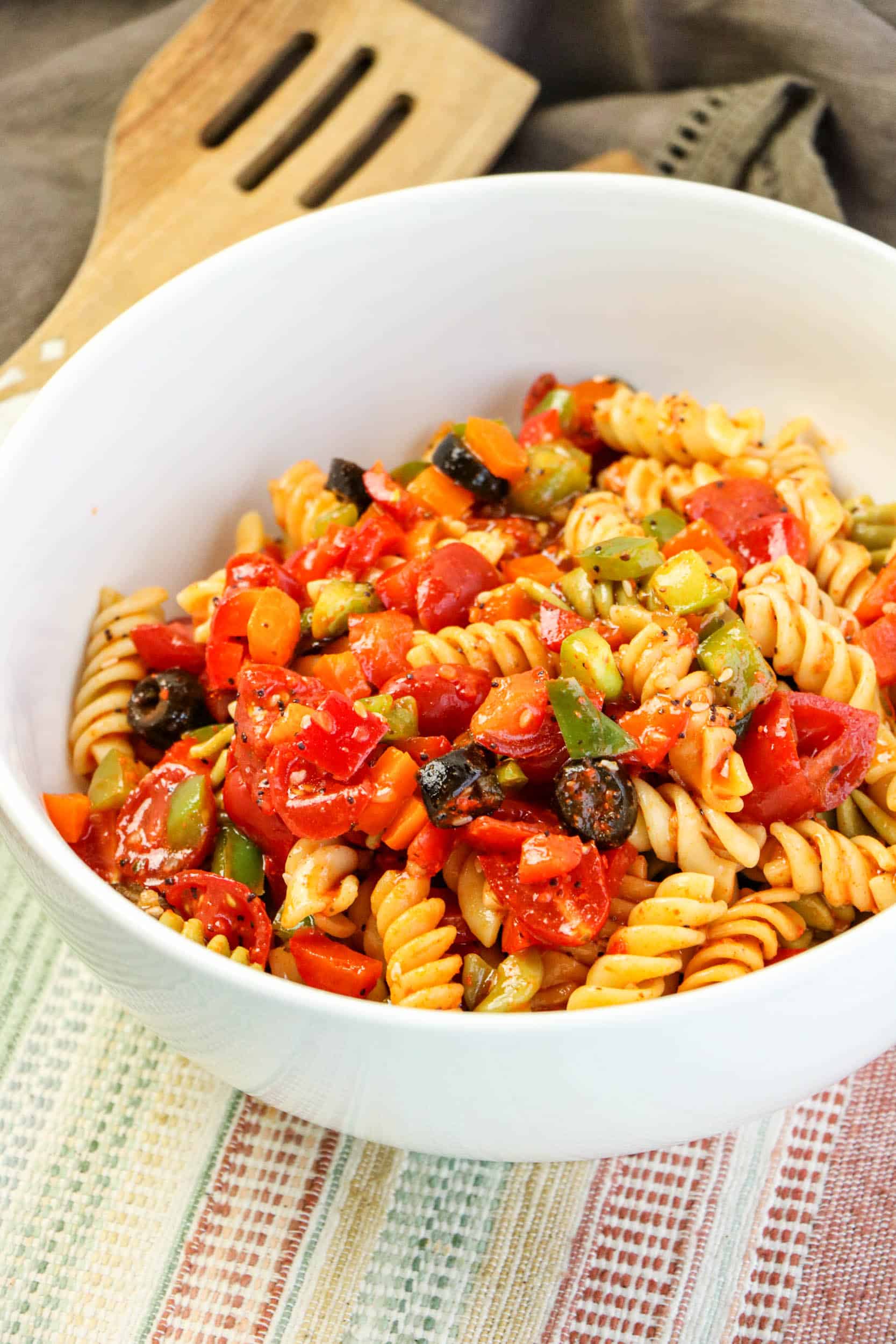 Italian Rotini Pasta Salad in a white bowl.