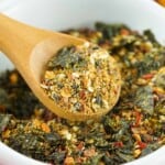 Shichimi Togarashi Blend in a white bowl with a wood measuring spoon.