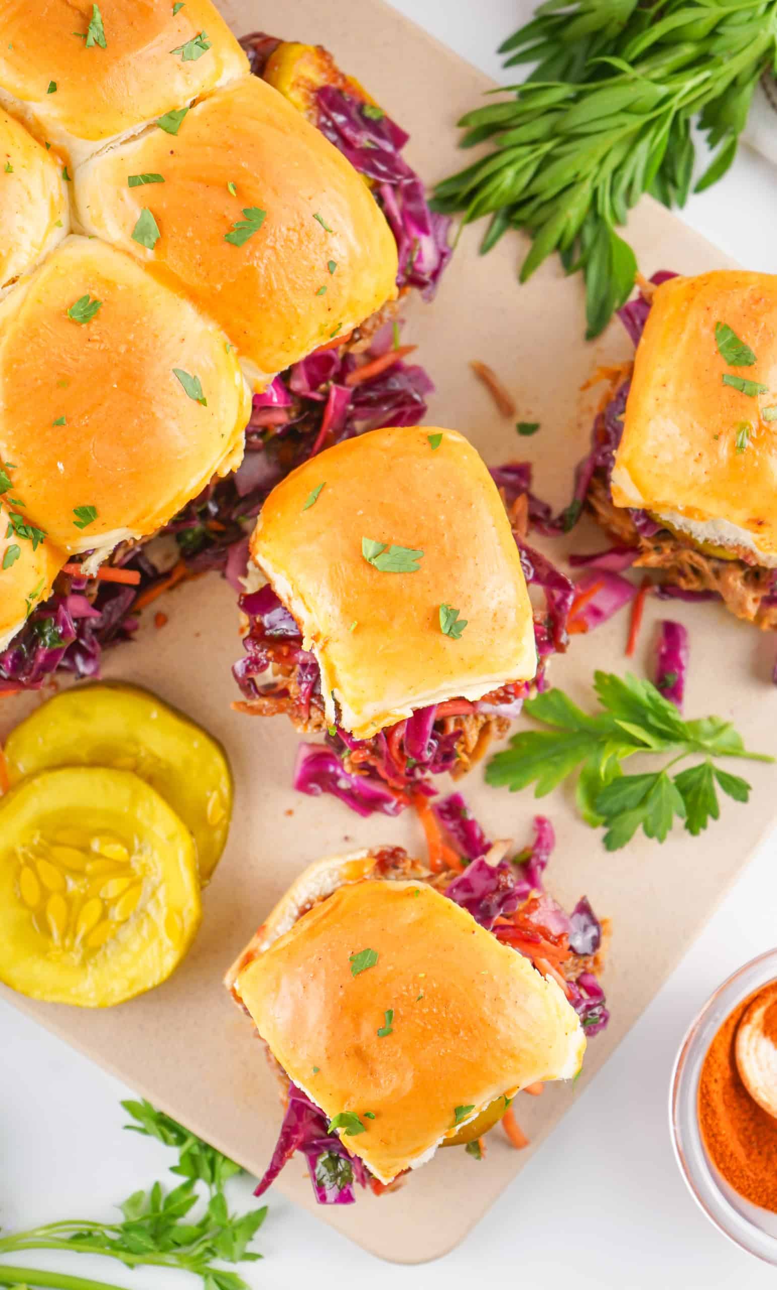 Overhead view of pulled pork sliders on Hawaiian rolls.