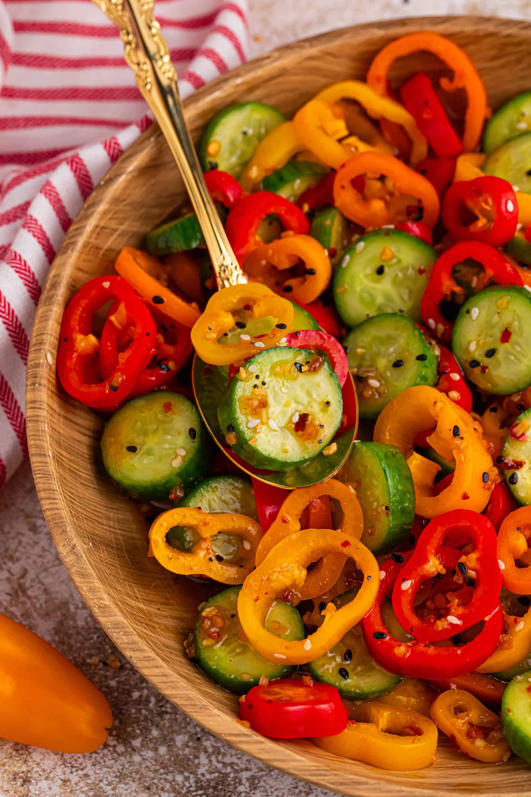 TikTok Pepper Salad being served with a gold spoon.