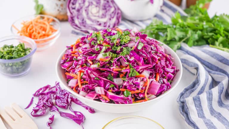 Red Cabbage Coleslaw in a white bowl.