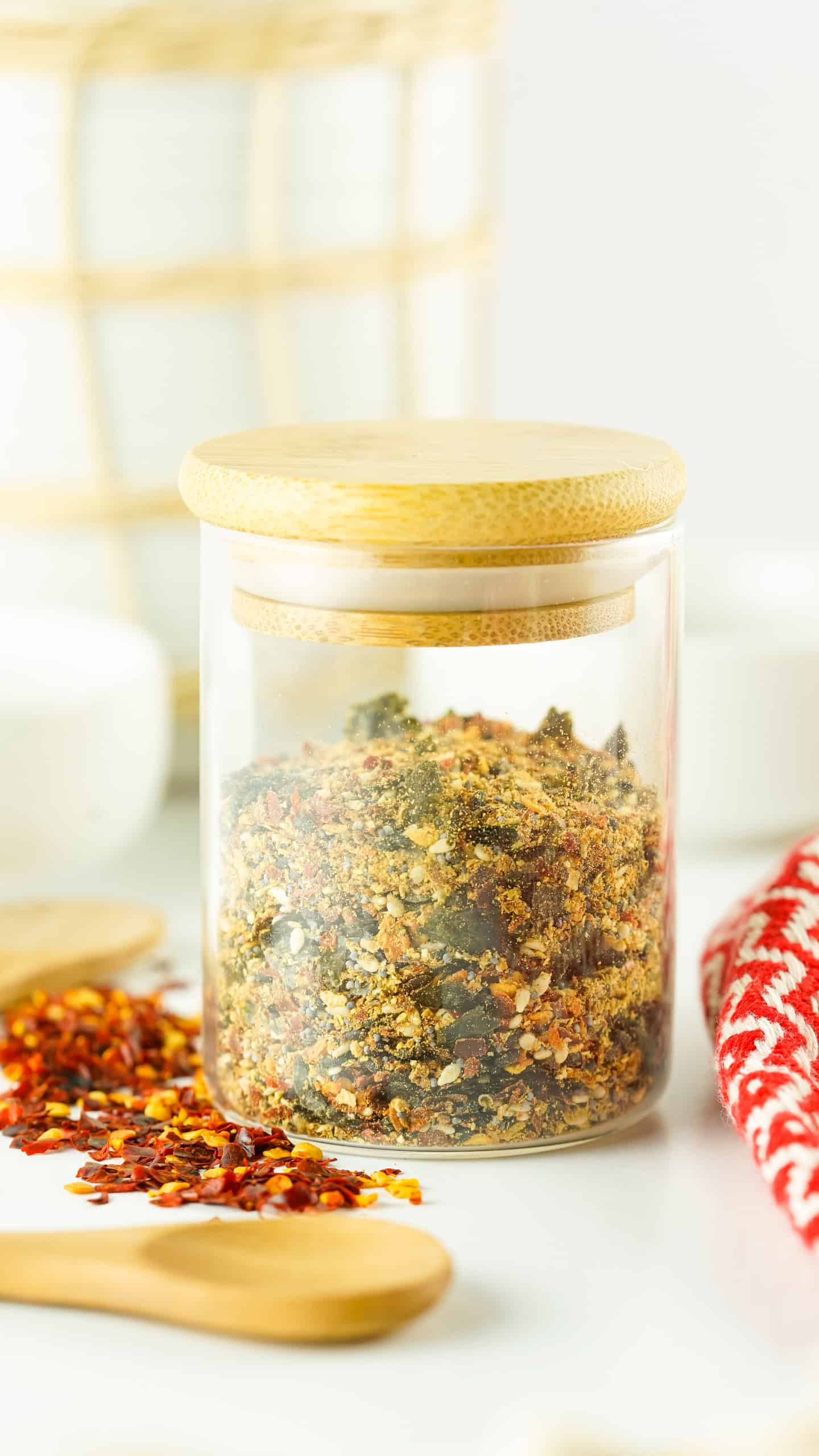 Shichimi Togarashi Spice blend in a glass spice bottle.