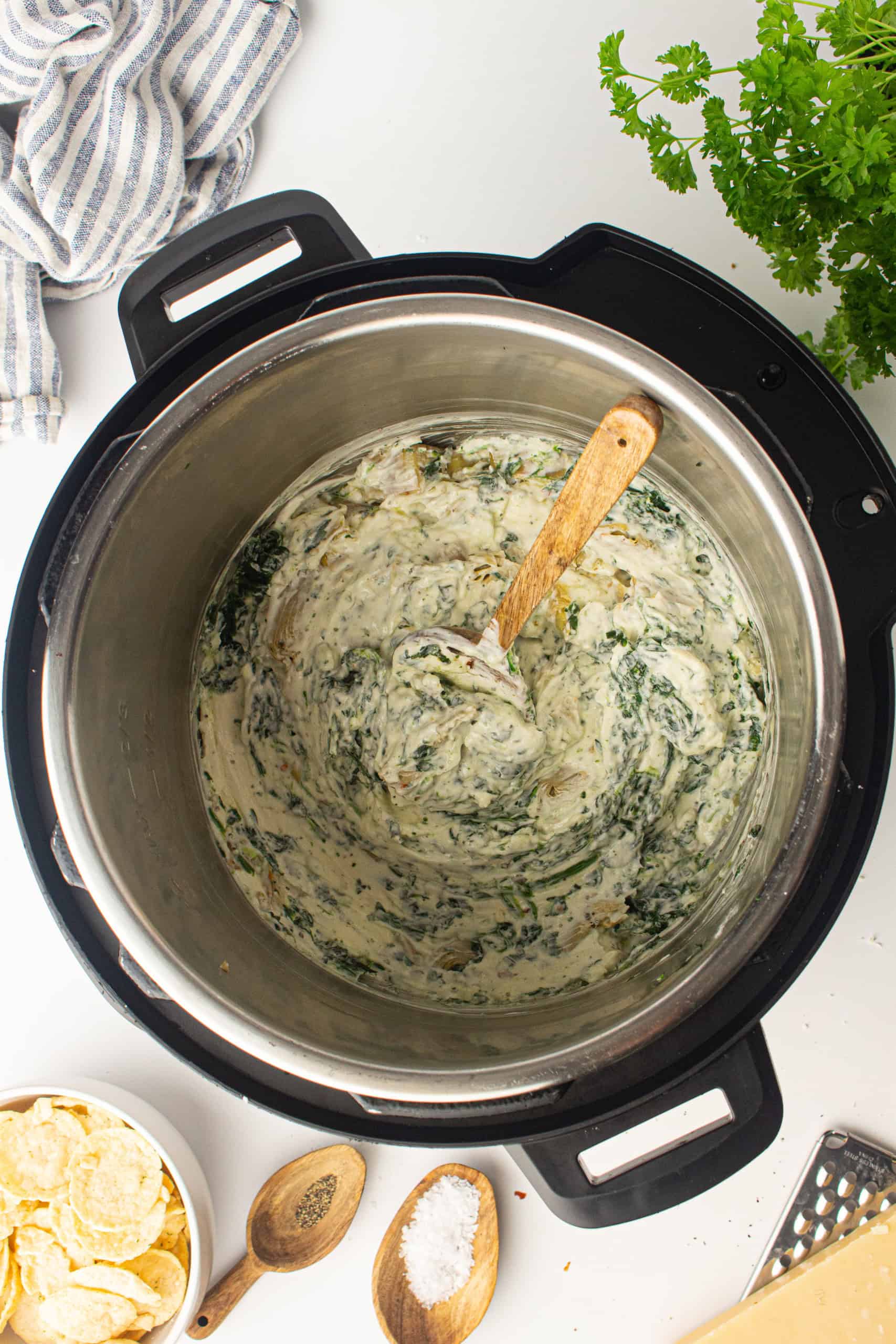 Overhead view of cooked spinach artichoke dip in Instant Pot.