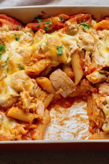 Pasta Bake with tuna in a casserole dish with a serving missing.