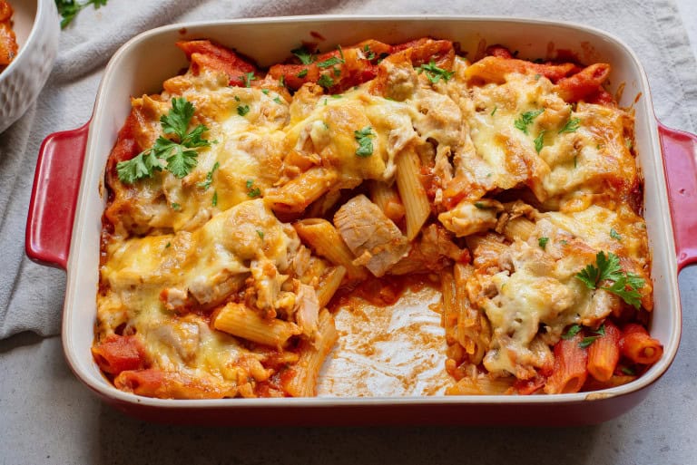 Pasta Bake with tuna in a casserole dish with a serving missing.