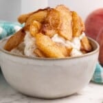 Air fryer apples served over vanilla ice cream.