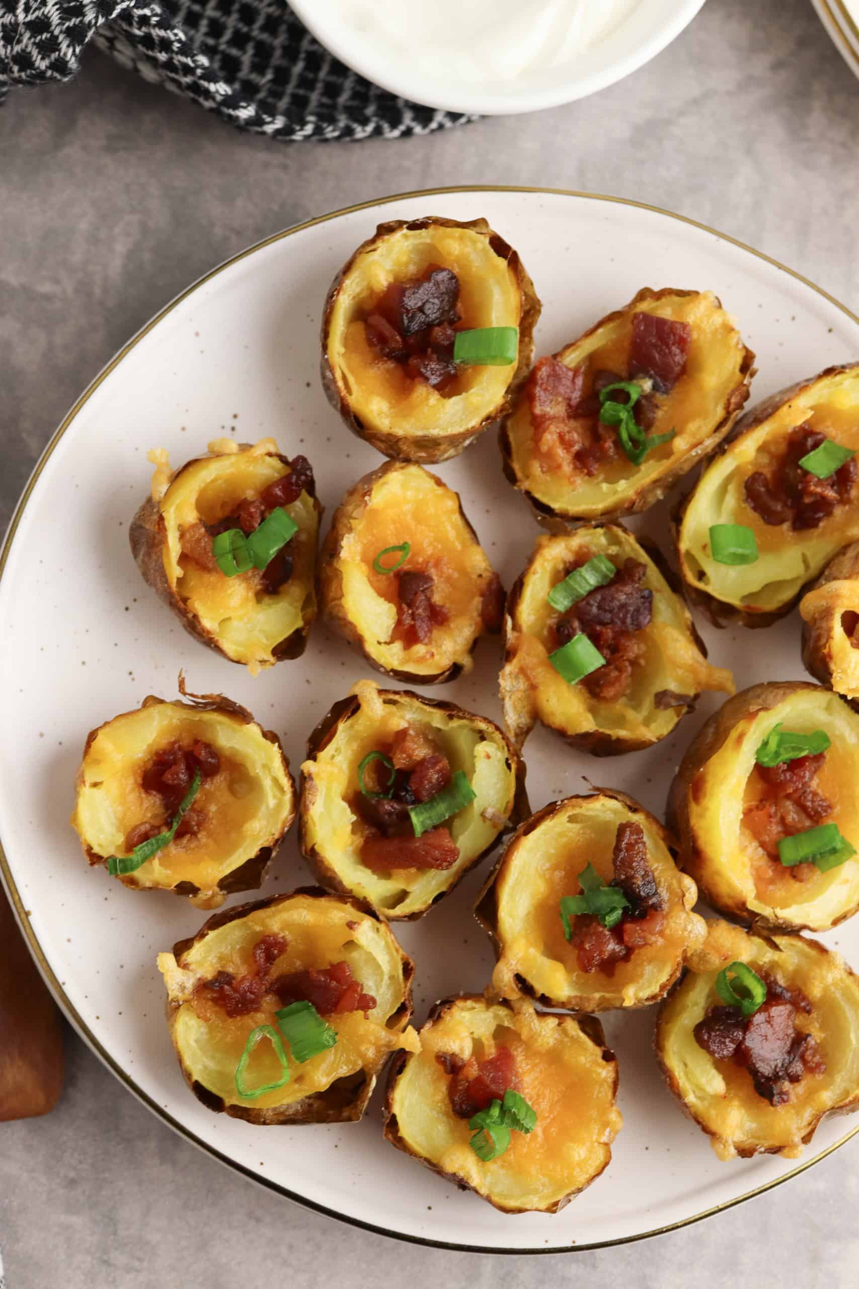 Overhead view of bacon cheese potato skin.