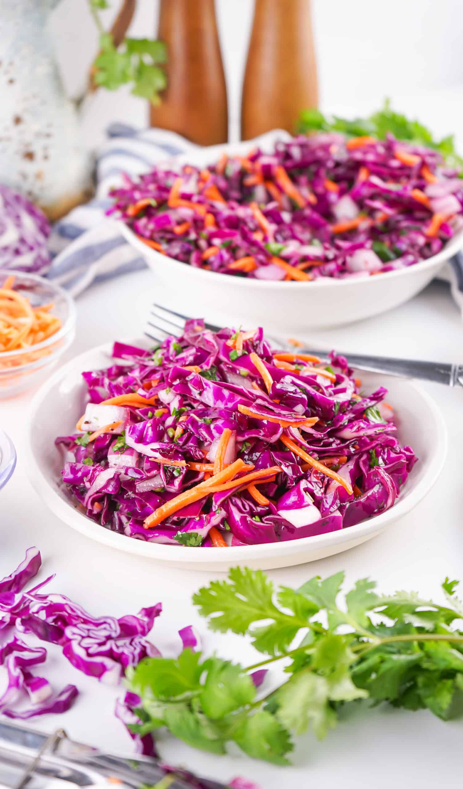 Coleslaw served in a white bowl.