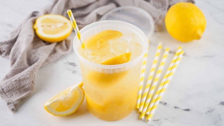Fair-style lemonade with straw in it.