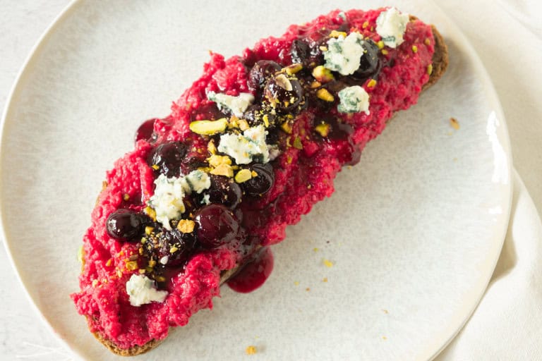 Overhead view of toast with beet hummus.