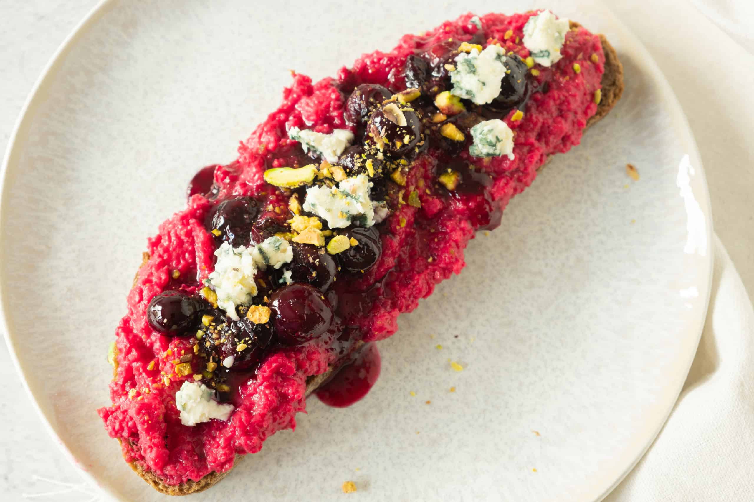 Overhead view of toast with beet hummus.
