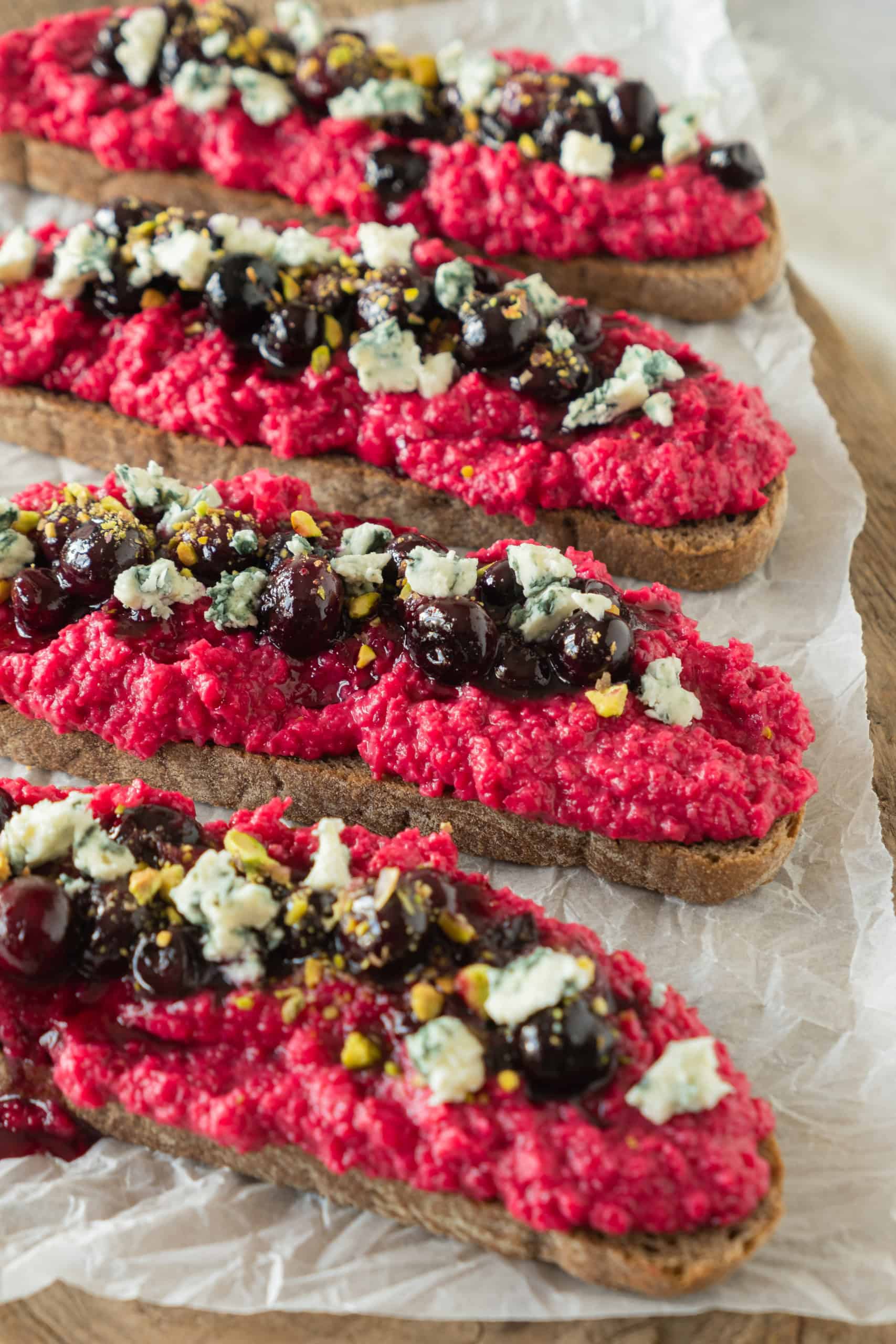 Side view of beetroot hummus toast.