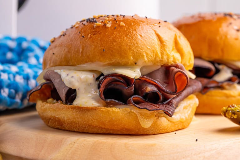 Head-on photo of air fryer swiss beef sandwiches.