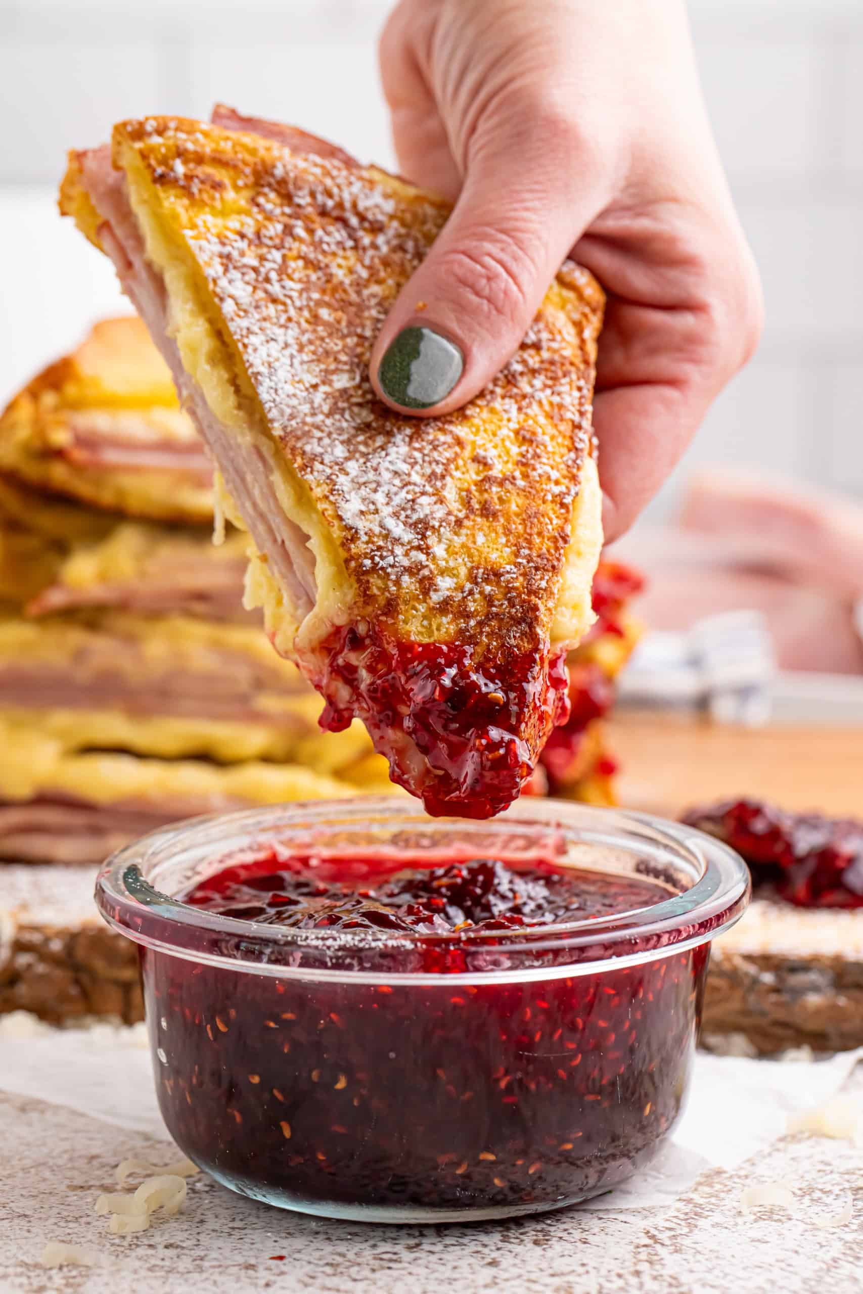 Monte cristo sandwich dipped in raspberry preserves.