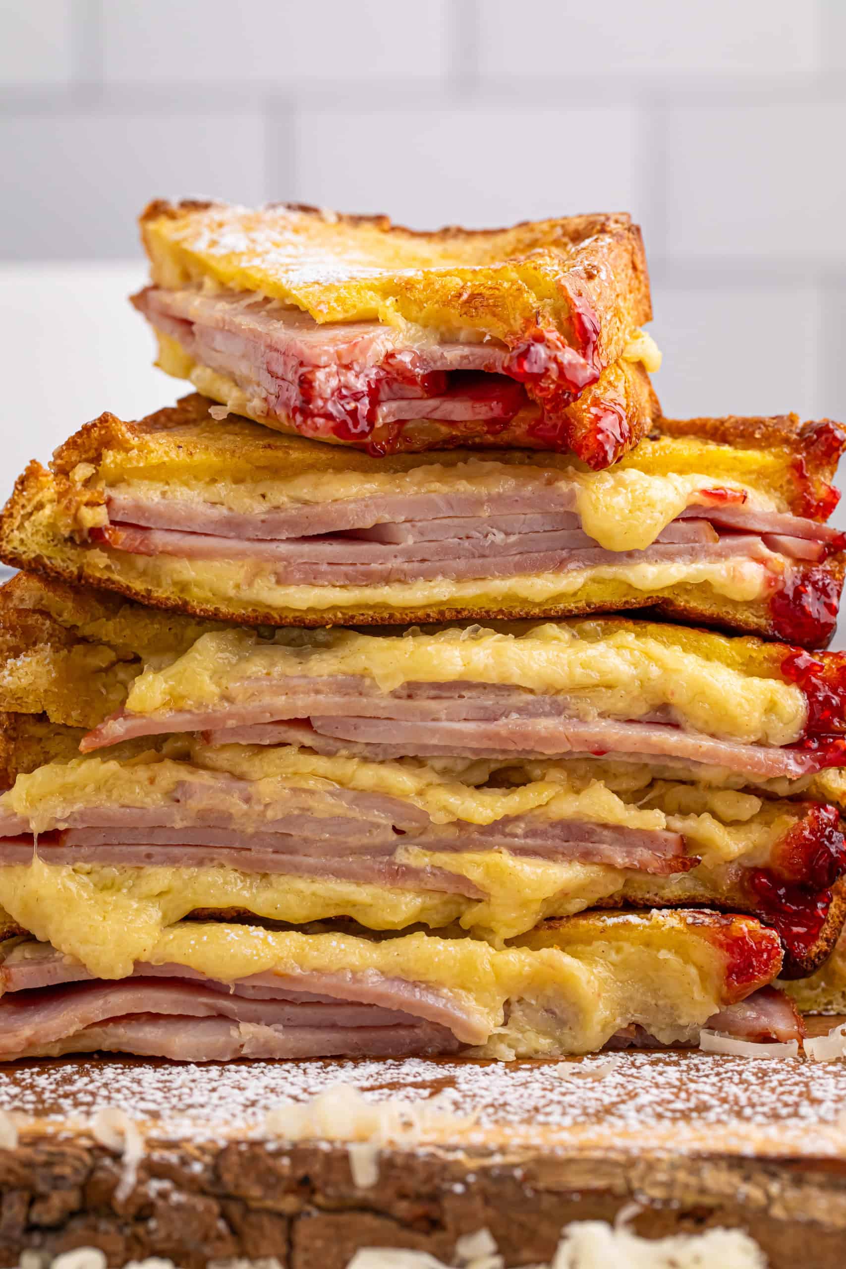 Headon photo of monte cristo sandwiches stacked on top of each other.