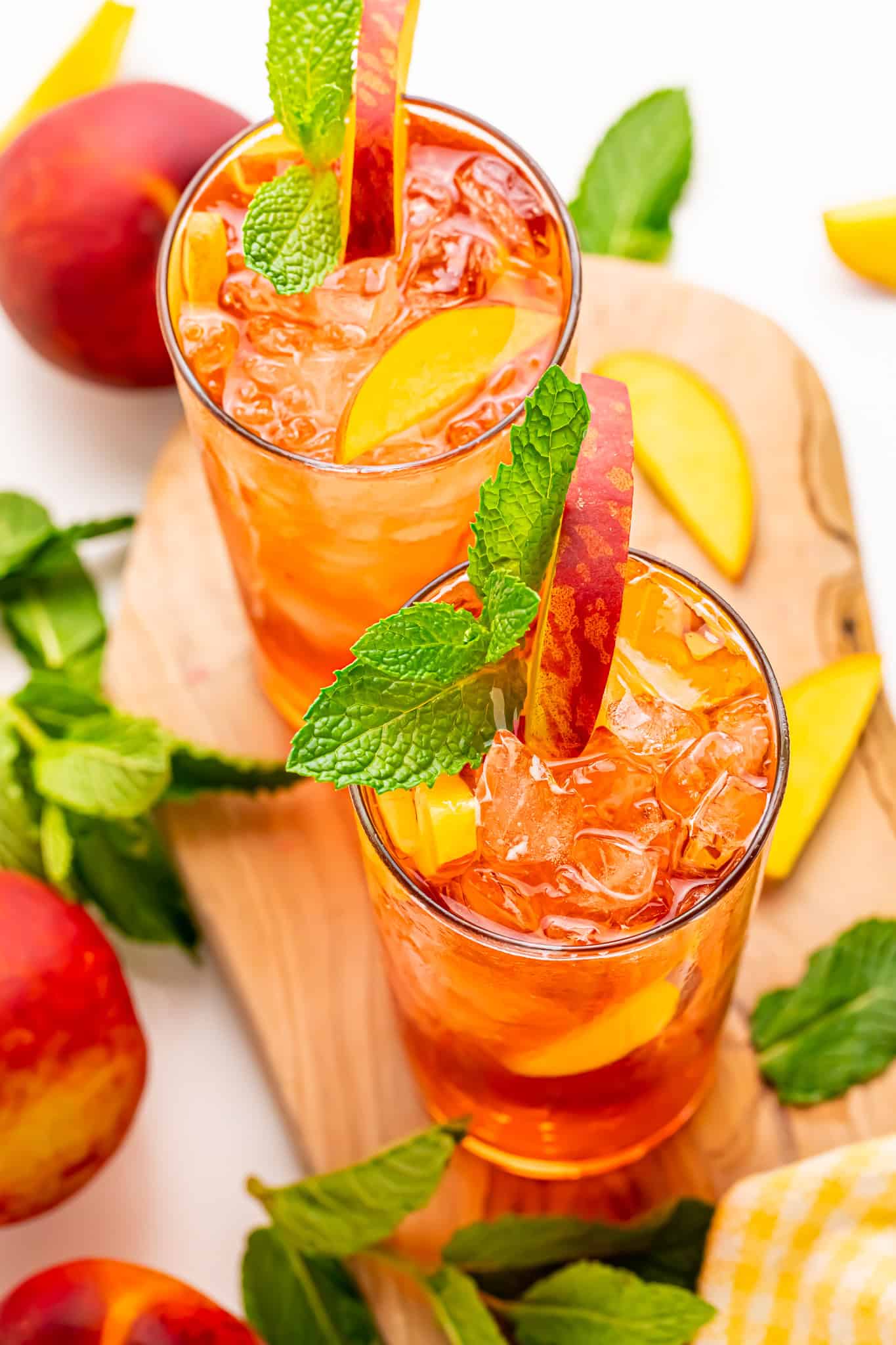 Two galsses sparkling peach tea with rum.