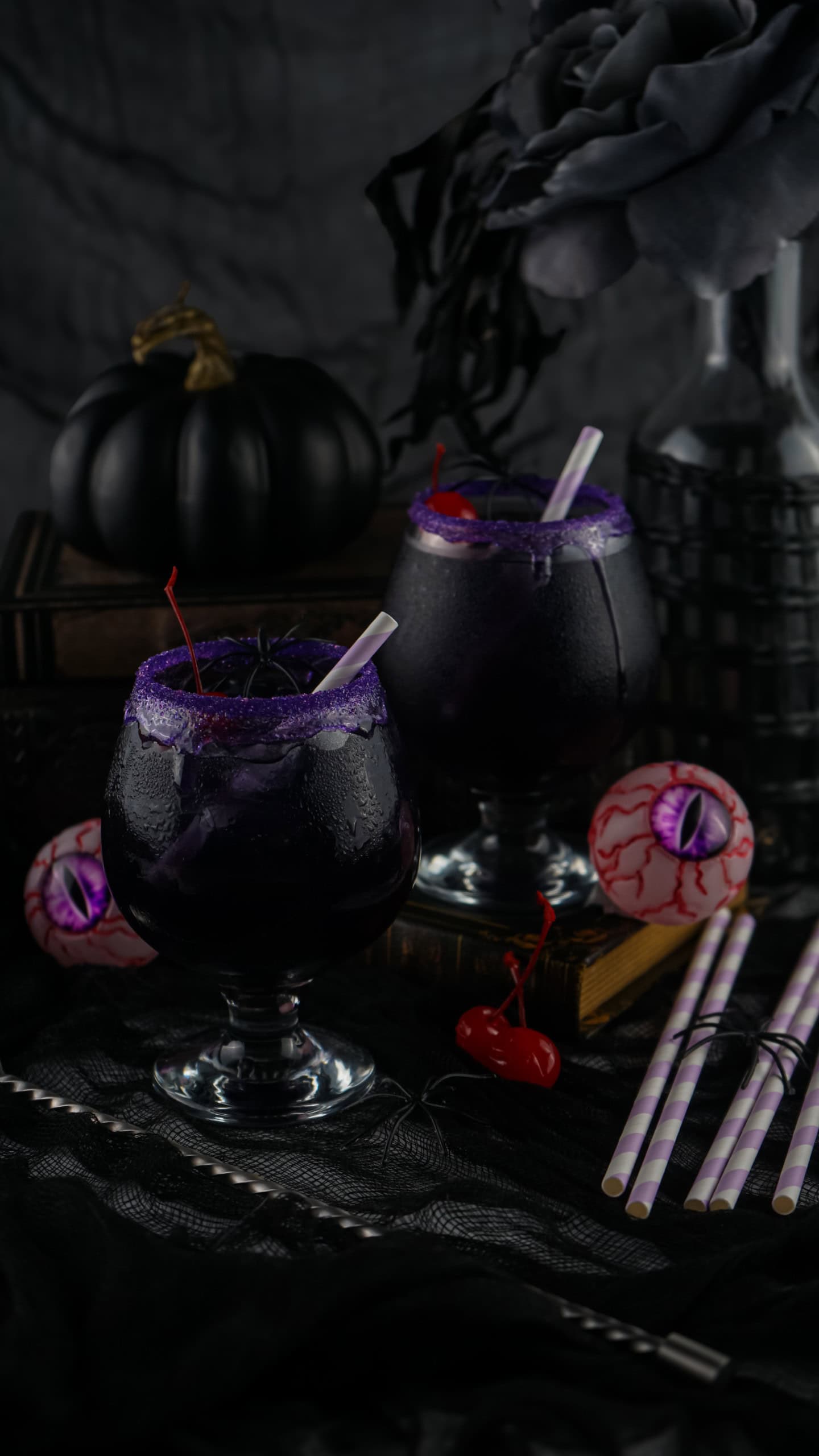 Headon view of purple Halloween cocktails.