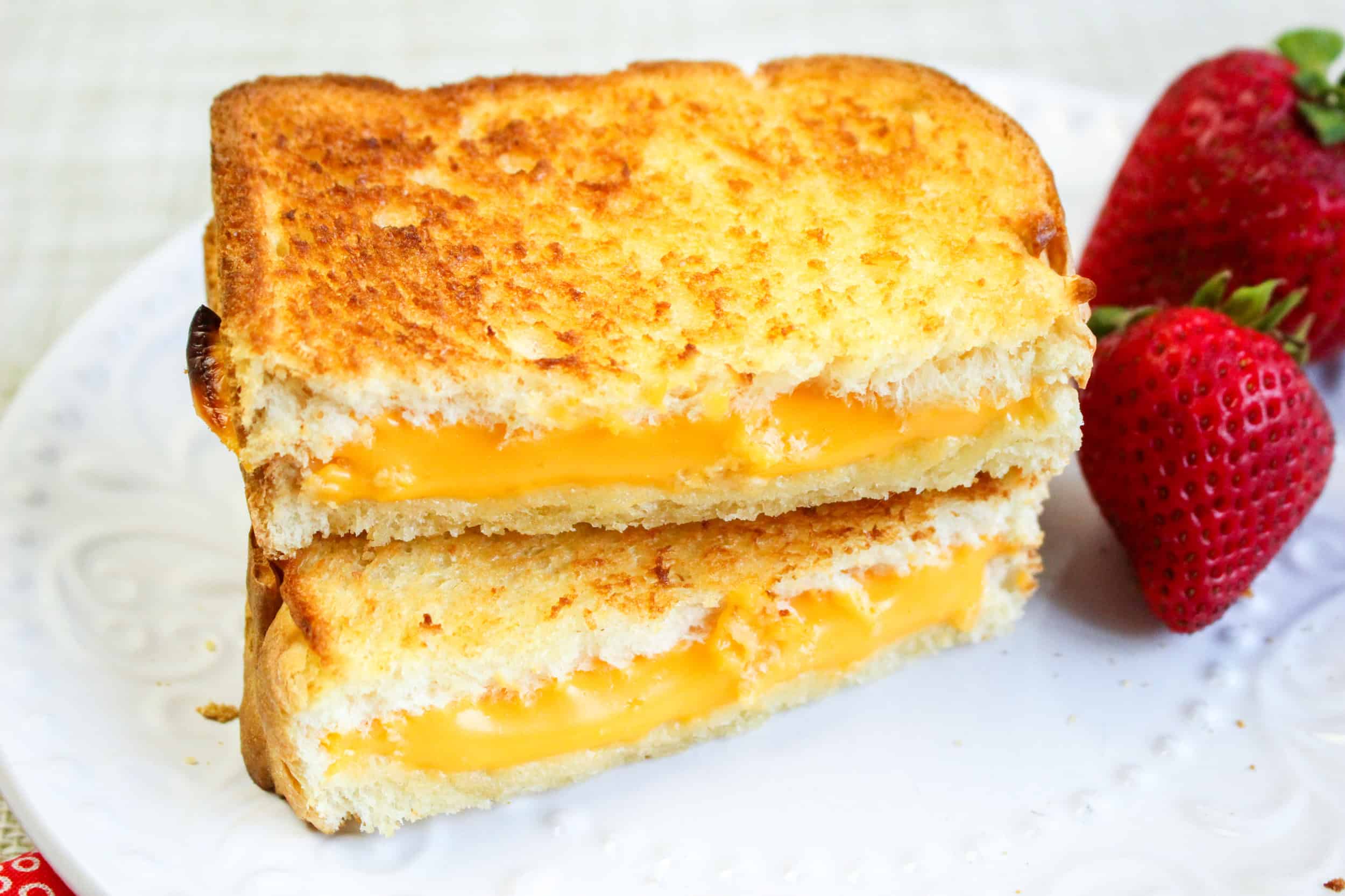 Air fryer grilled cheese sandwich cut in half.