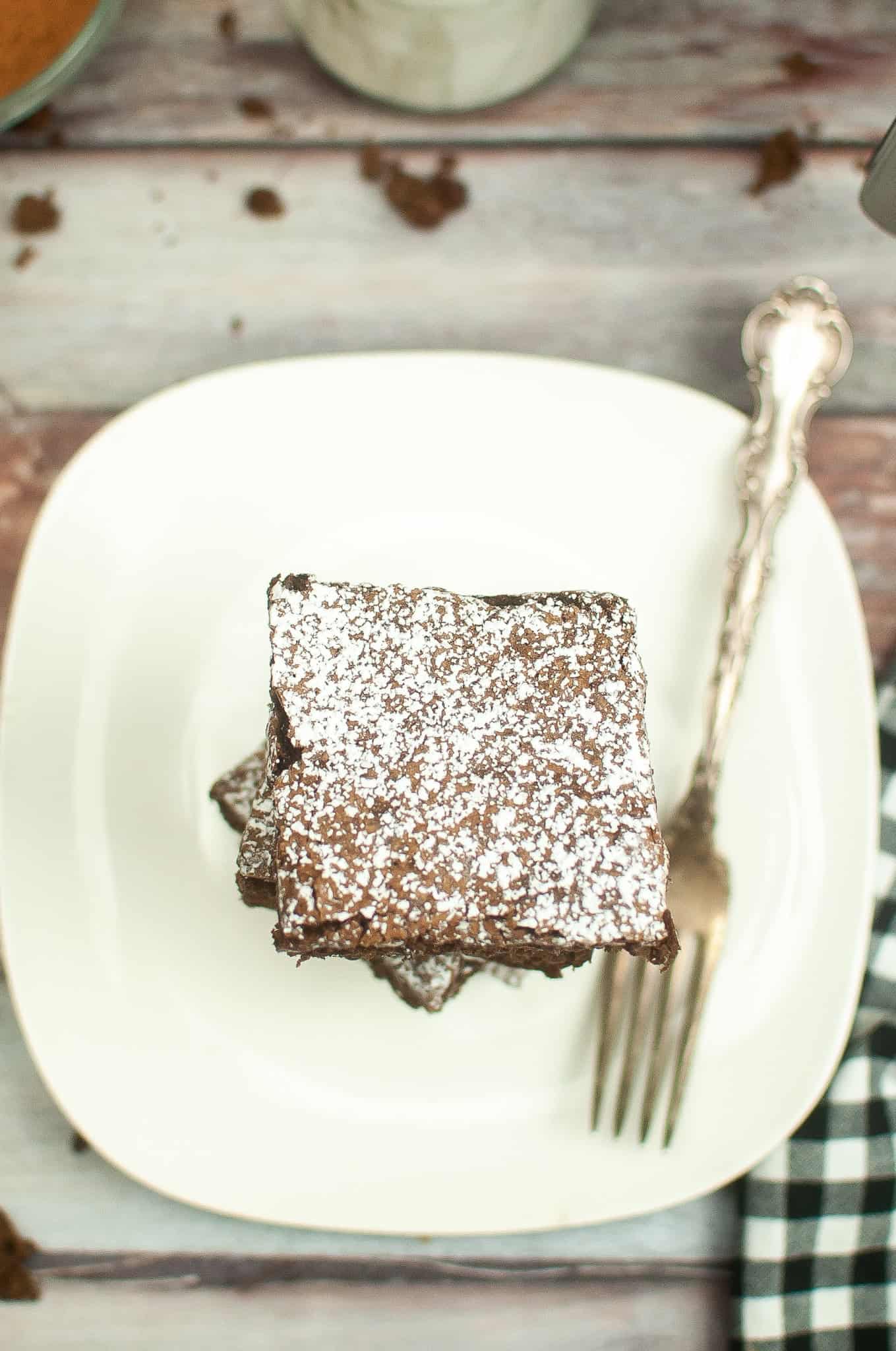 Overhead view of brownie with powder sugar on top.