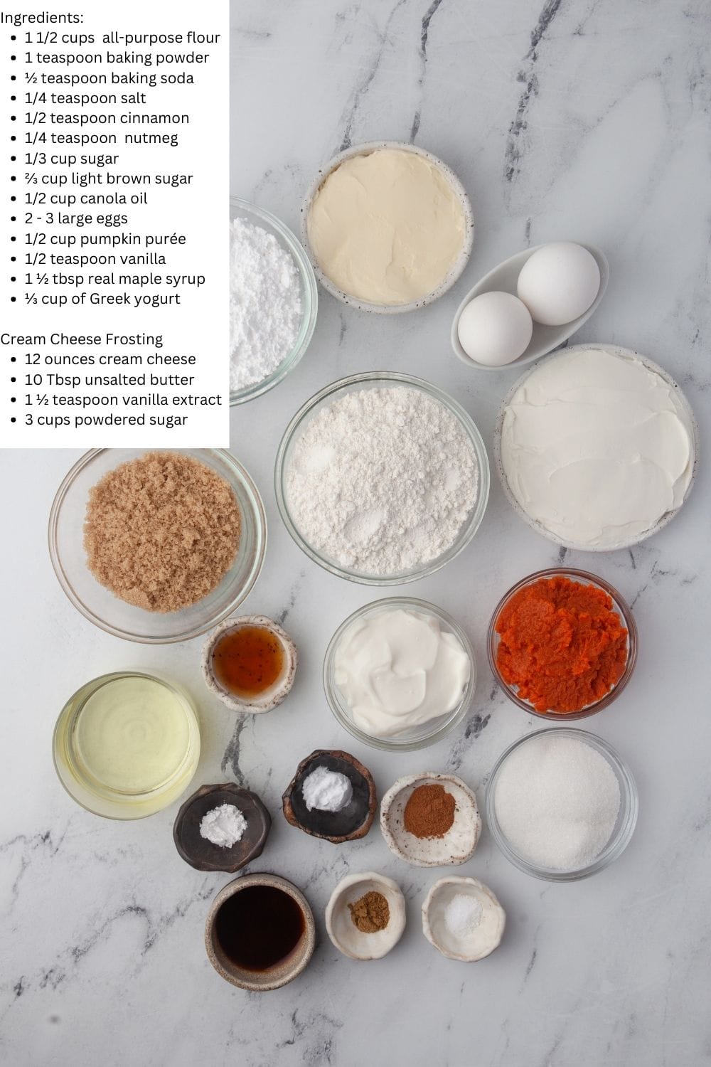 Overhead view of pumpkin spice cupcake with cream cheese frosting ingredients.