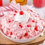 Fireball Fluff Salad with whipped cream and a cherry on top.