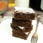 Stack of air fryer brownies on a square white plate.