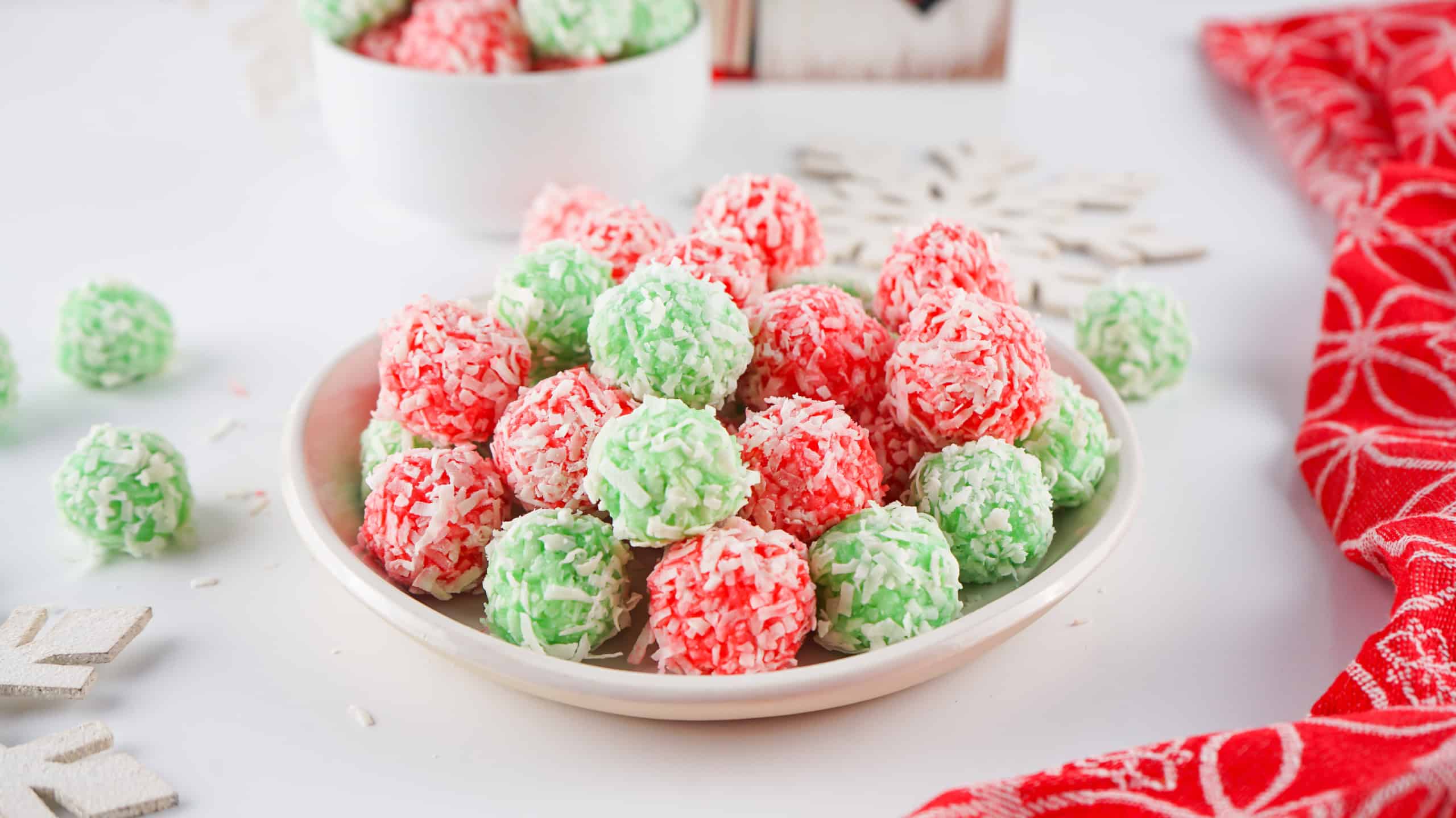 Old fashioned Jello Balls in a shallow white bowl.