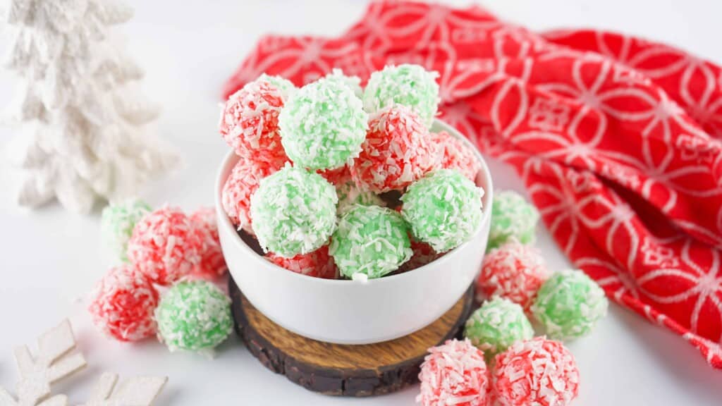 Red and green Jello balls rolled in shredded coconut.