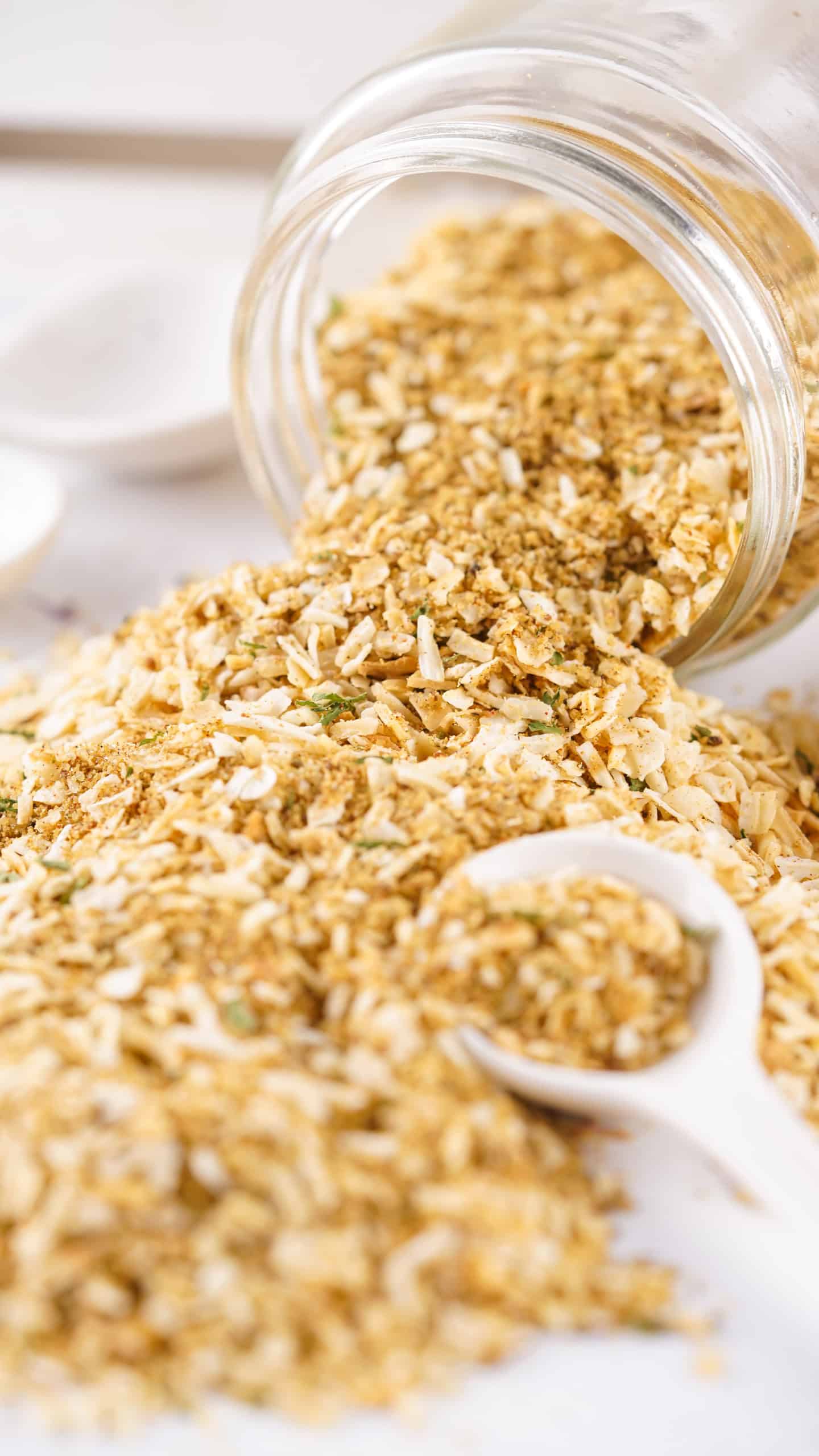 Onion soup mix spilling out of a jar.