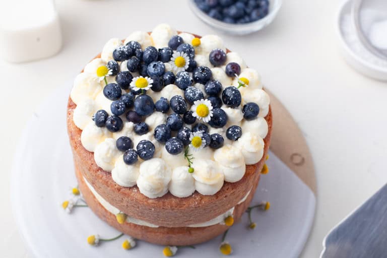 Overhead view of blueberry honey chamomile cake.