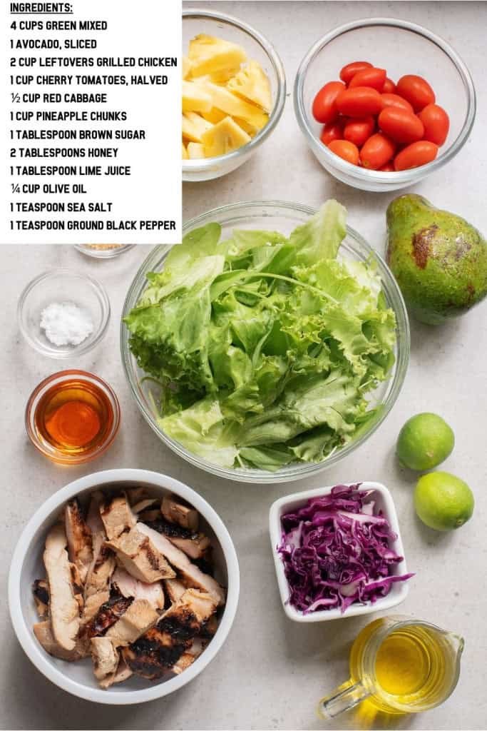Overhead view of chicken and pineapple salad with avocado ingredients.