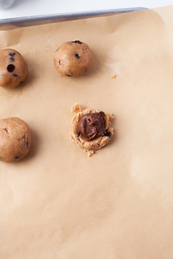 cookie dough balls and frozen nutella on top of cookie dough.