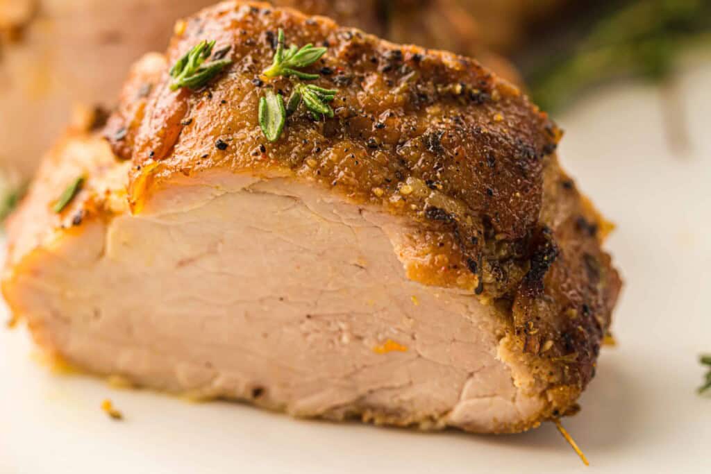 Headon view of sliced pork tenderloin.