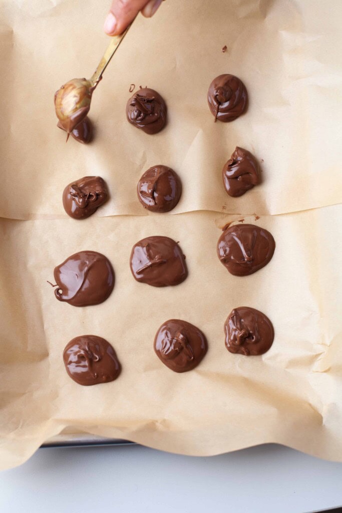 dollops of nutella on parchment paper.