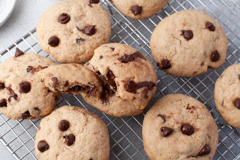 overhead view of nutella stuffed cookies on a wire baking rack.