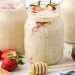 Headon view of strawberry overnight oats in Mason jars.